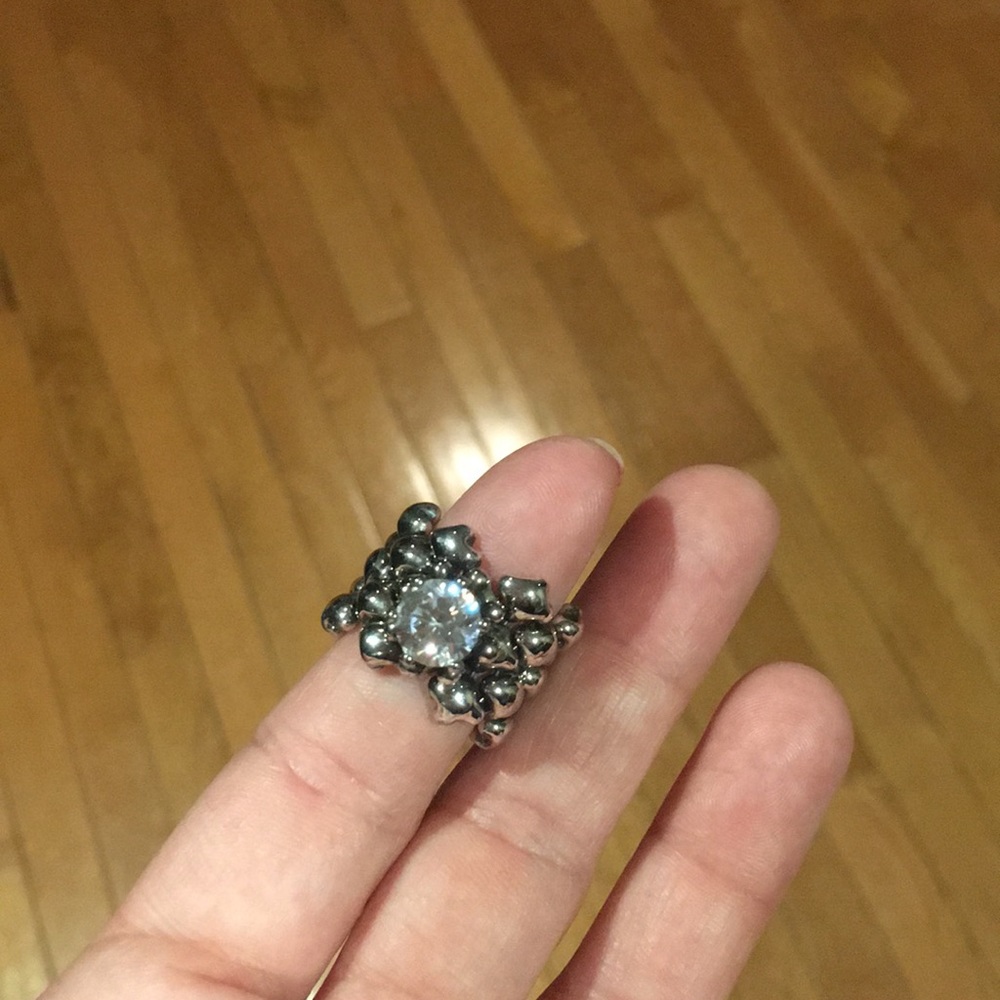 One sterling silver ring with cz center stone